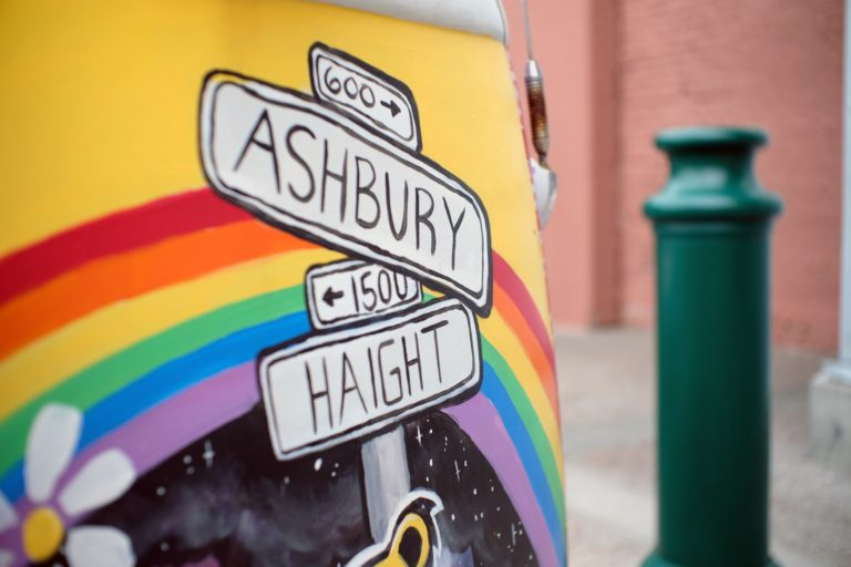 Closeup shot of a drawn street sign leading to Ashbury and Haight
